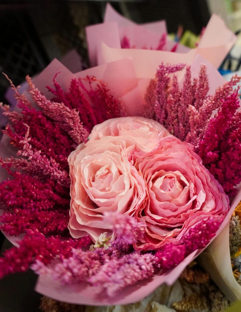 Beautiful bouquet with pink roses and decorative flowers, perfect for romantic occasions.